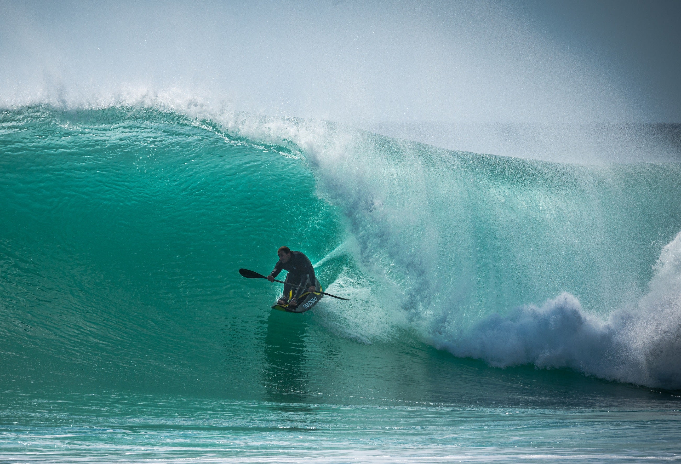 Mike Wessels charging a huge wave on a custom Macski waveski.